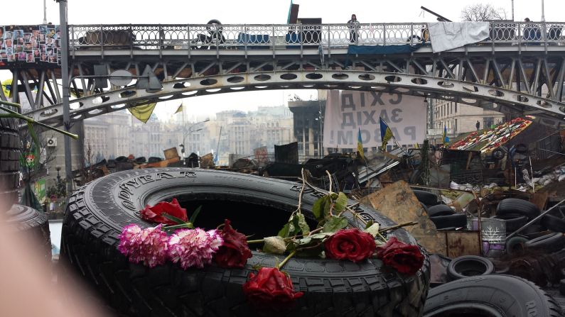 KIEV, UKRAINE:  Portraits of people killed during clashes with riot police are left with candles and flowers at Kiev's Independence Square on March 6.  Photo by CNN's Michael Holmes.  Follow Michael on Instagram at <a href="https://trans.hiragana.jp/ruby/http://instagram.com/holmescnn" target="_blank" target="_blank">instagram.com/holmescnn</a>.