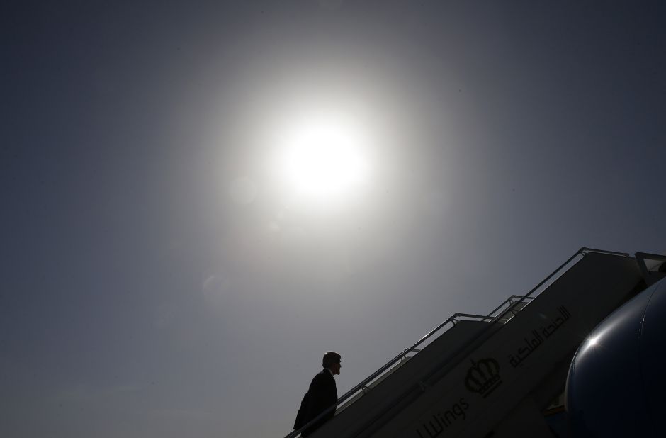 Kerry boards a plane in Amman, Jordan, where in May 2013 he met with leaders to discuss the ongoing conflict in Syria.