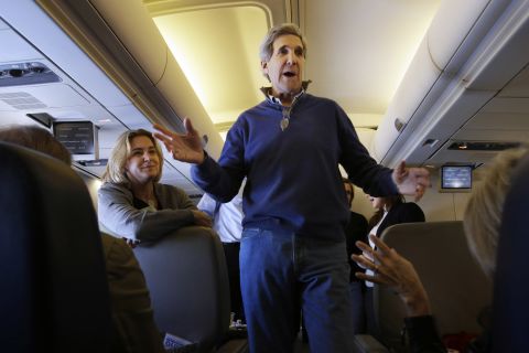 Kerry talks to reporters en route to London on his first trip as secretary of state in February 2013. The trip took him through European and Middle Eastern capitals.