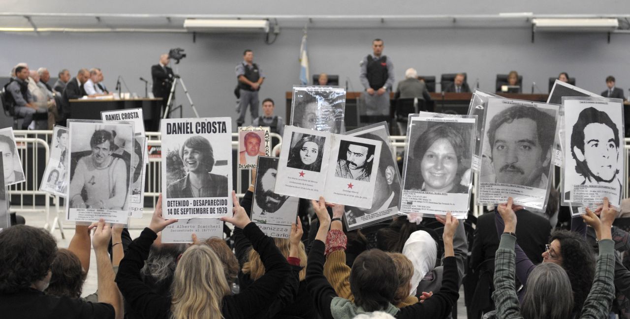 People hold portraits of missing relatives at the trial of former Argentina ruler Reynaldo Bignone in 2010. Charged with kidnap and torture, Bignone was sentenced to 25 years in prison -- and the 86-year-old has been convicted of other crimes since. 