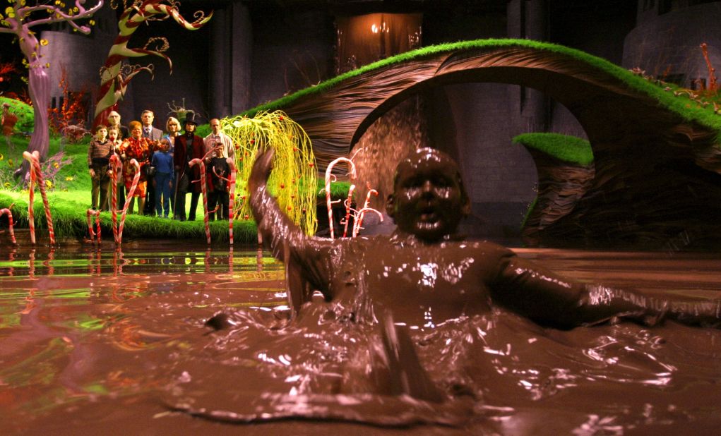 <strong>"Charlie and the Chocolate Factory" (2005):</strong> Glutton Augustus Gloop (Philip Wiegratz) falls into the chocolate river as the others watch from shore in the remake of this classic childhood tale starring Johnny Depp.