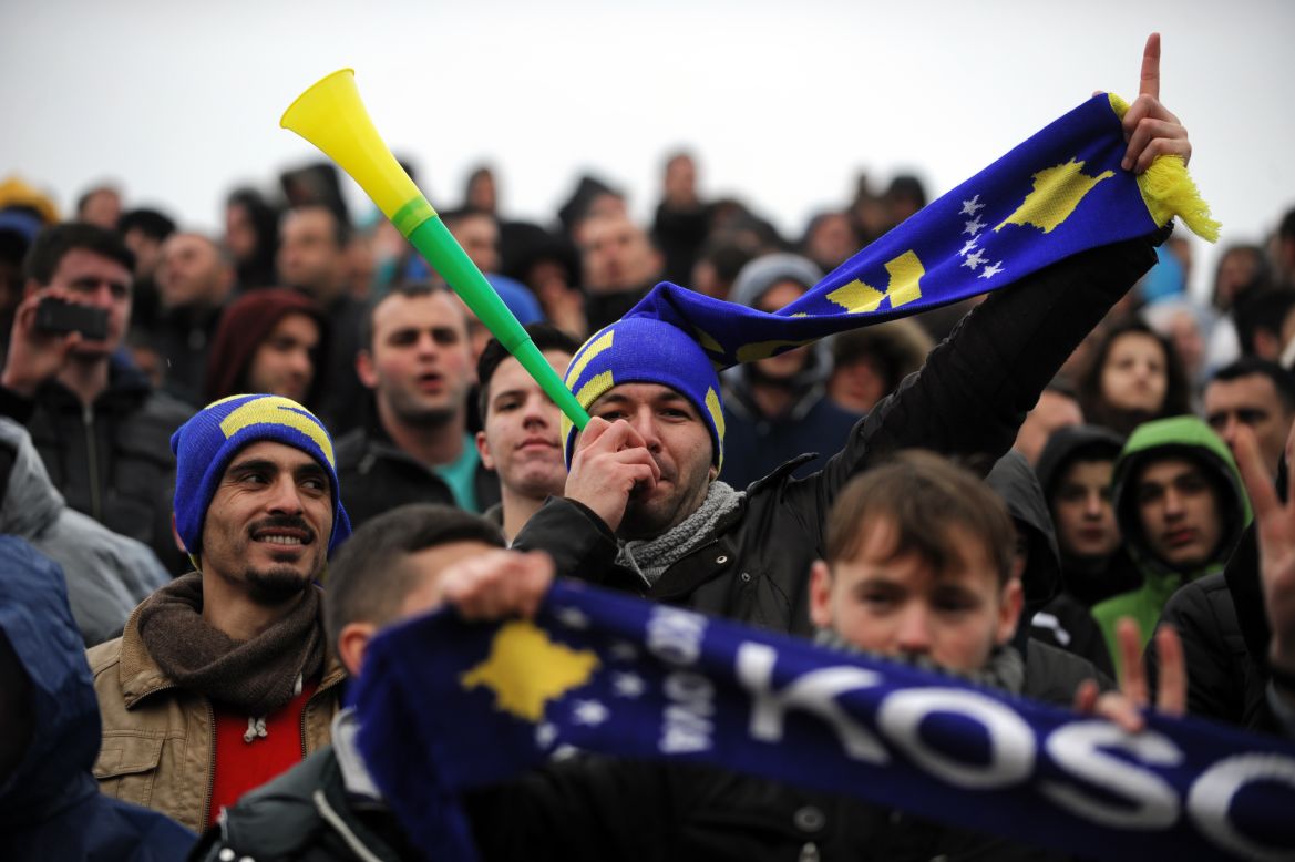MITROVICA, KOSOVO - MARCH 6: A supporter of the Kosovo team blows into a vuvuzela during a friendly football match against Haiti. Six years after declaring independence from Serbia, Kosovo drew 0-0 in their FIFA-approved debut on the international stage.