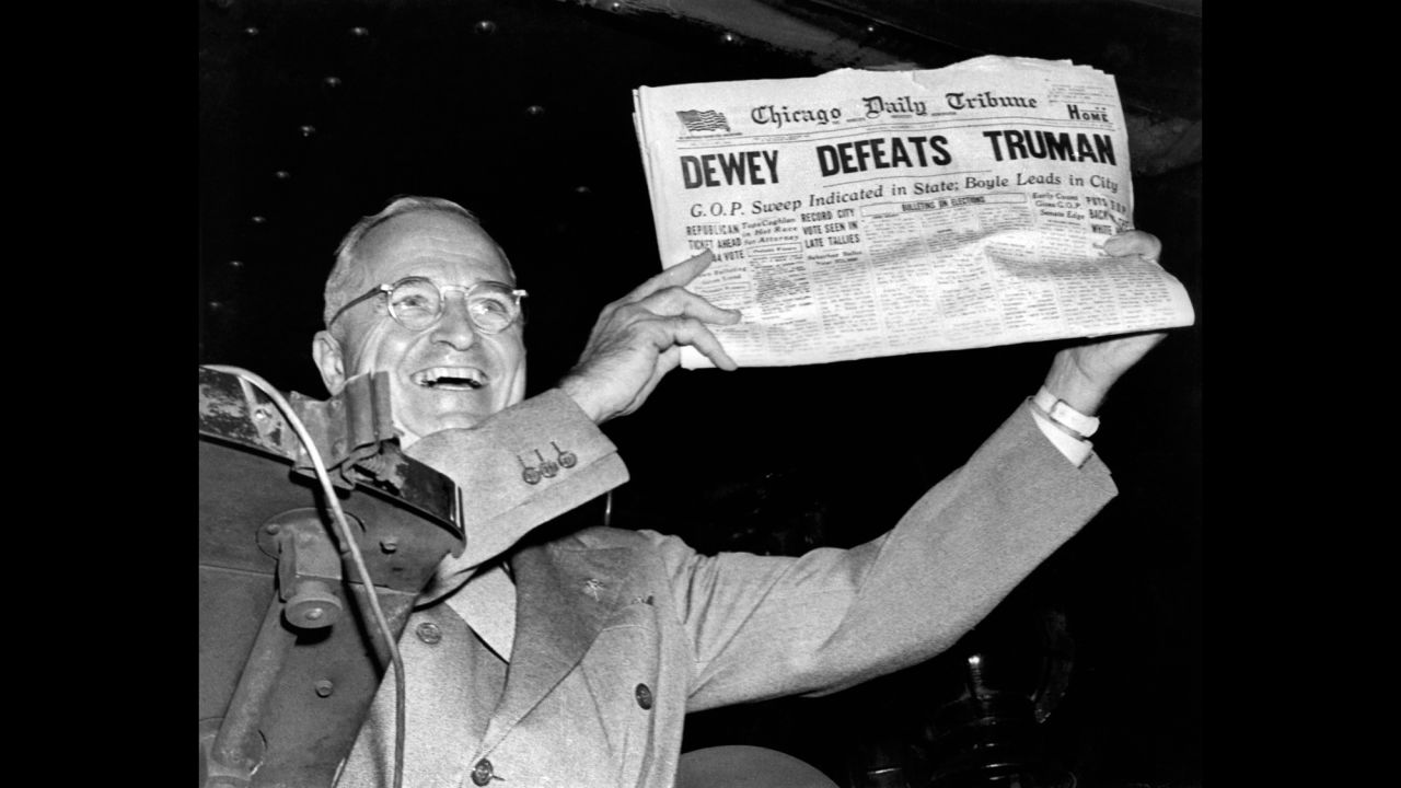 Harry Truman holds up the Chicago Daily Tribune  with a headline of his "defeat" to Thomas Dewey in 1948.