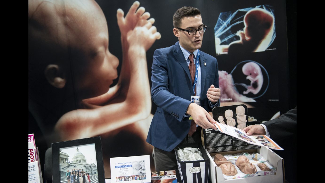 Andrew Bair, of National Right to Life, hands out material at CPAC on Thursday.