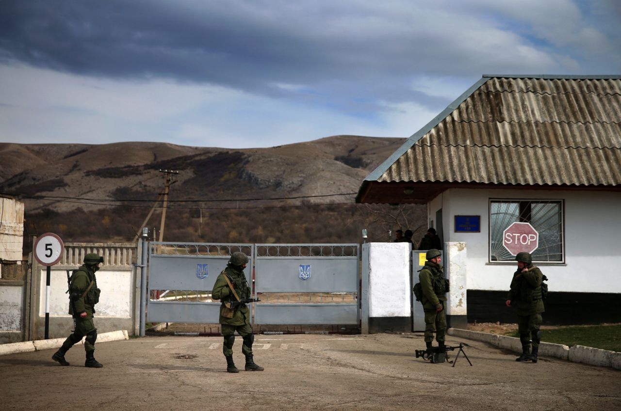 Servicemen guard a checkpoint at a Ukrainian navy base in Perevalne on March 6.