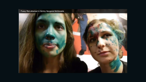 A screen capture from a Youtube video posted by Russian punk band Pussy Riot shows members' faces smeared in paint after an attack in a McDonald's.