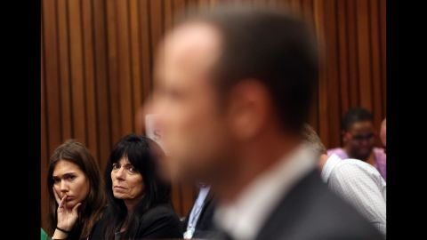 Friends of Steenkamp's family watch Pistorius during his trial on March 7.