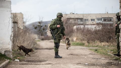 A member of the Russian military patrols around Perevalne on March 6.