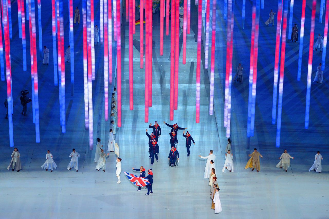 Skier Millie Knight leads Great Britain into the stadium.