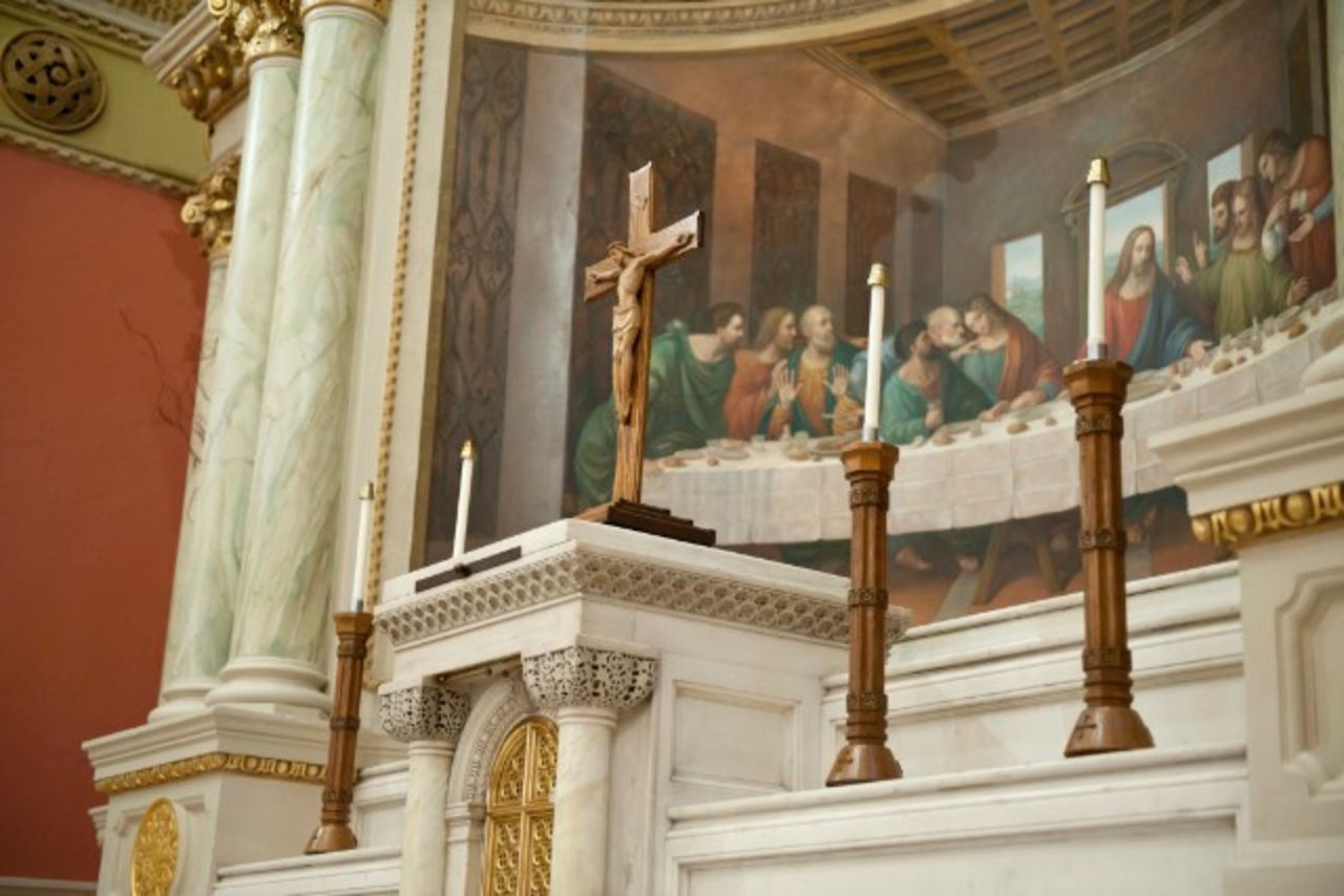 Behind the altar at St. Cecilia Parish is a tableau of the Last Supper. - (Webb Chappell for CNN)