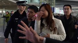 A woman believed to be the relative of a passenger onboard Malaysia Airlines flight MH370 cries at the airport in Beijing on Saturday, March 8.