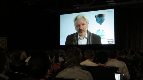 Exiled WikiLeaks founder Julian Assange speaks to a festival audience in Austin, Texas, via livestream from London.