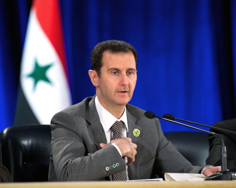 A handout photo released by SANA shows Syrian President Bashar al-Assad speaking March 8 during a meeting in Damascus to mark the 51st anniversary of the 1963 revolution, when Baath Party supporters in the Syrian army seized power. Al-Assad said the country will go on with reconciliation efforts along with its fight against terrorism.