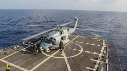 A U.S. Navy Sea Hawk helicopter lands abard the  USS Pinckney to change crew before returning to search for the missing Malaysian airliner on March 9 in the Gulf of Thailand.