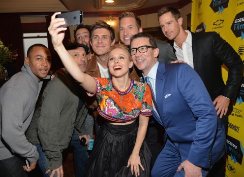 Actress Kristen Bell poses for a selfie with fellow "Veronica Mars" cast members at the premiere of the  "Veronica Mars" movie on Saturday, March 8.  
