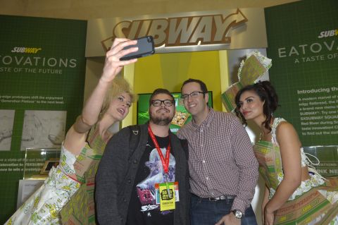 Jared "The Subway Guy" and Subway models pose for a selfie on March 8 with a fan.