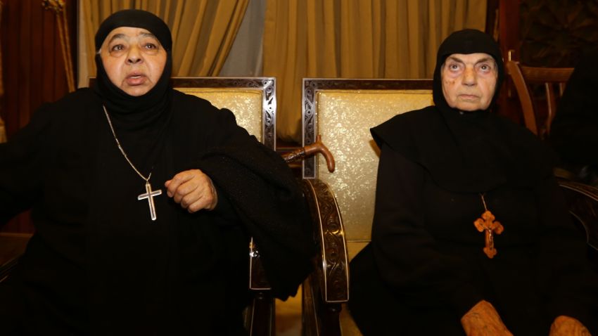 Kidnapped nuns arrive at Jdeidet Yabus on the Syrian side of the border with Lebanon after an arduous nine-hour journey that took them from Yabrud into Lebanon, and then back into Syria on March 10, 2014.