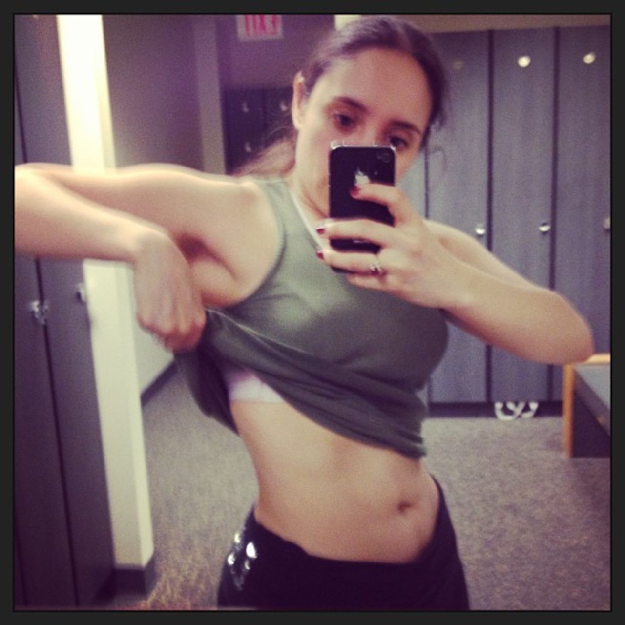Osegueda works out three to four times a week. Here she is in 2013, at the gym, "showing off my 'ab sprouts'." 