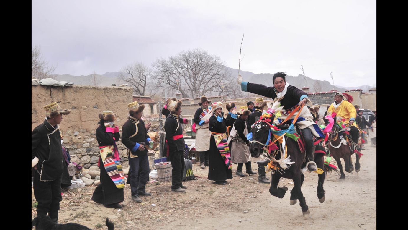 Villagers in Lhasa, Tibet, take part in a horse racing event Wednesday, March 5, during a ceremony marking the start of spring plowing. In the Daga Village, it is tradition to hold the ceremony on the fourth day of Losar, the Tibetan New Year.