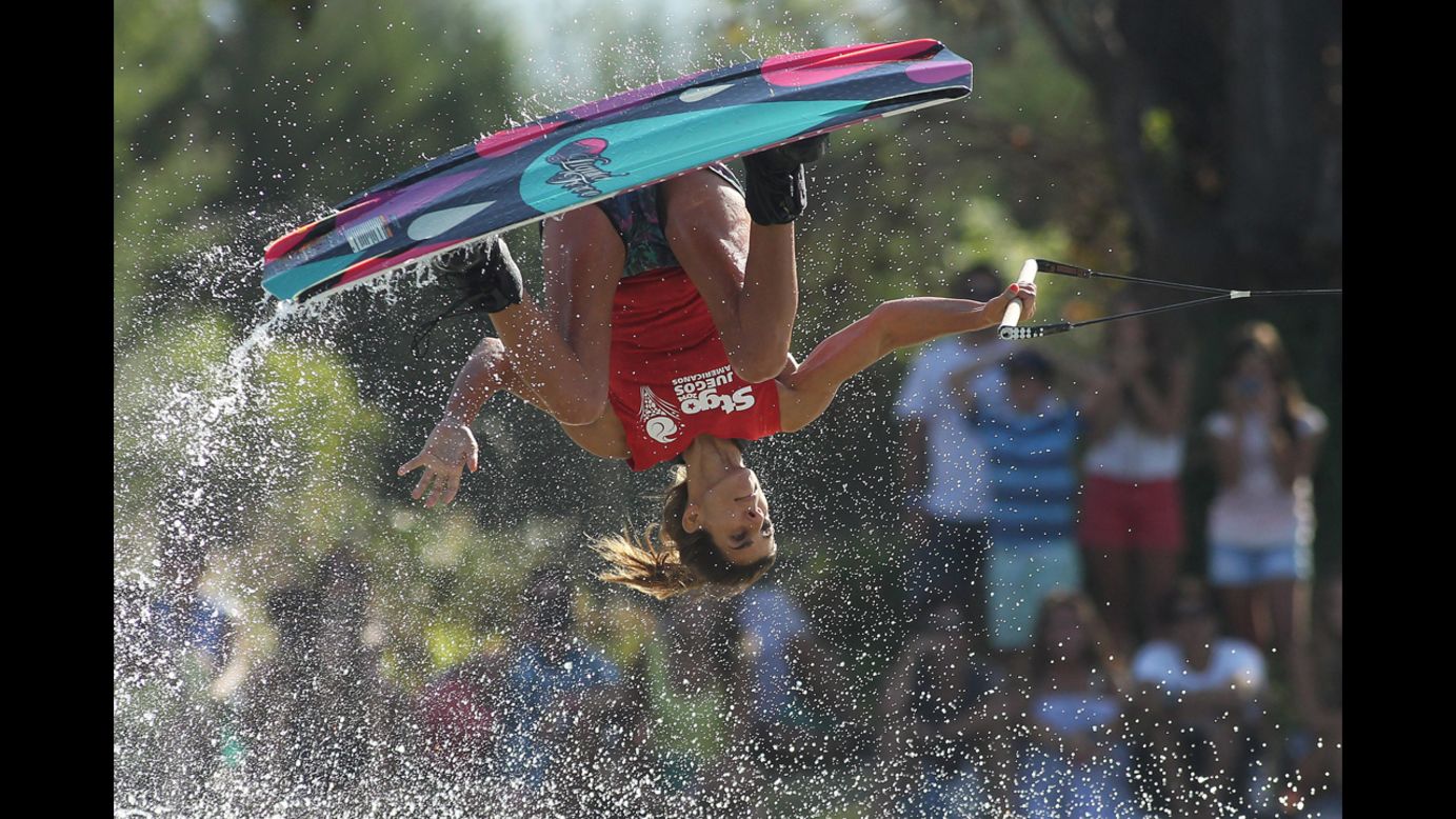 Roberta Rendo of Argentina flips upside down Saturday, March 8, during the wakeboard competition at the South American Games in Santiago, Chile.