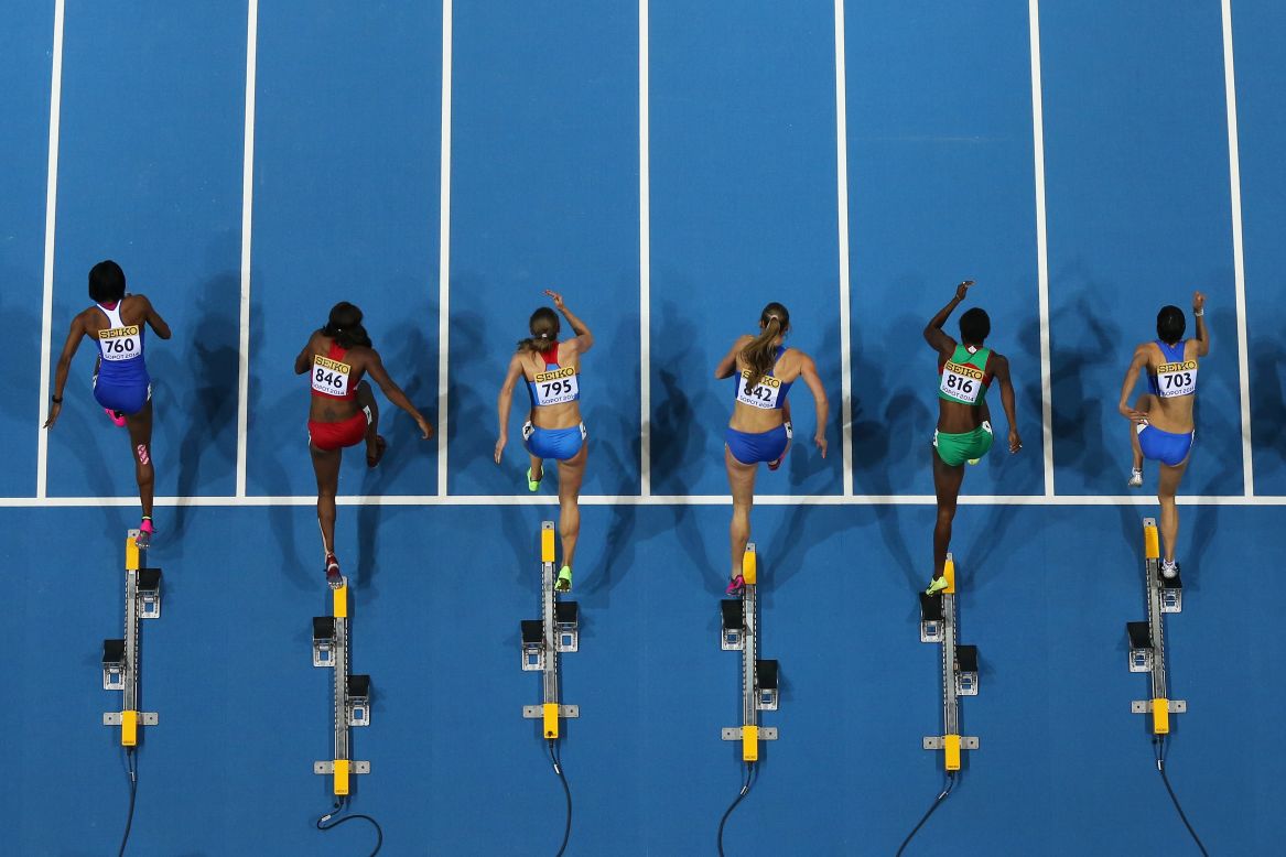 Hurdlers leave the blocks during a 60-meter race Friday, March 7, at the IAAF World Indoor Championships in Poland.