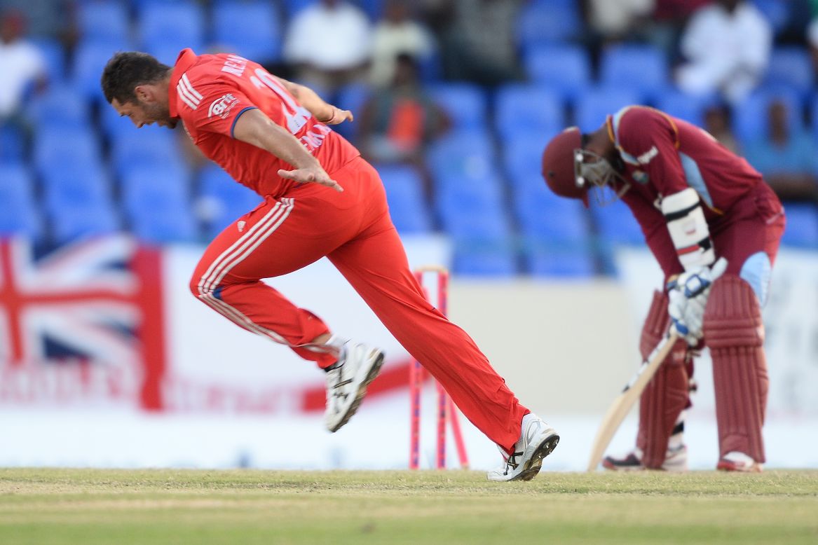 Bowler Tim Bresnan, left, takes the wicket of West Indies batsman Denesh Ramdin to give England victory Wednesday, March 5, in a One Day International match between the two teams.