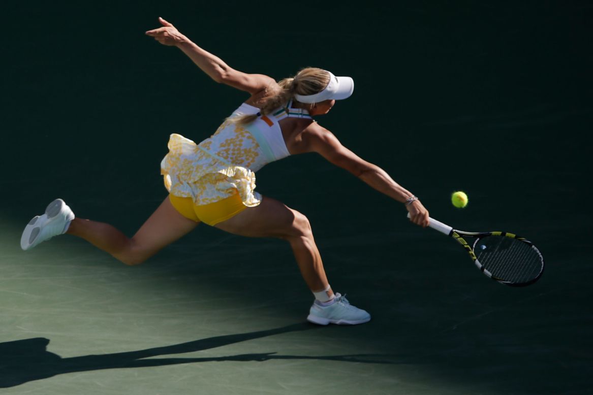 Caroline Wozniacki lunges for a backhand Sunday, March 9, during a tennis match against Yaroslava Shvedova at the BNP Paribas Open in Indian Wells, California.