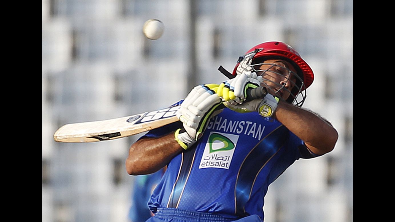 Afghanistan's Samiullah Shenwari avoids a bouncer against India during their one-day international cricket match Wednesday, March 5, at the Asia Cup in Dhaka, Bangladesh.