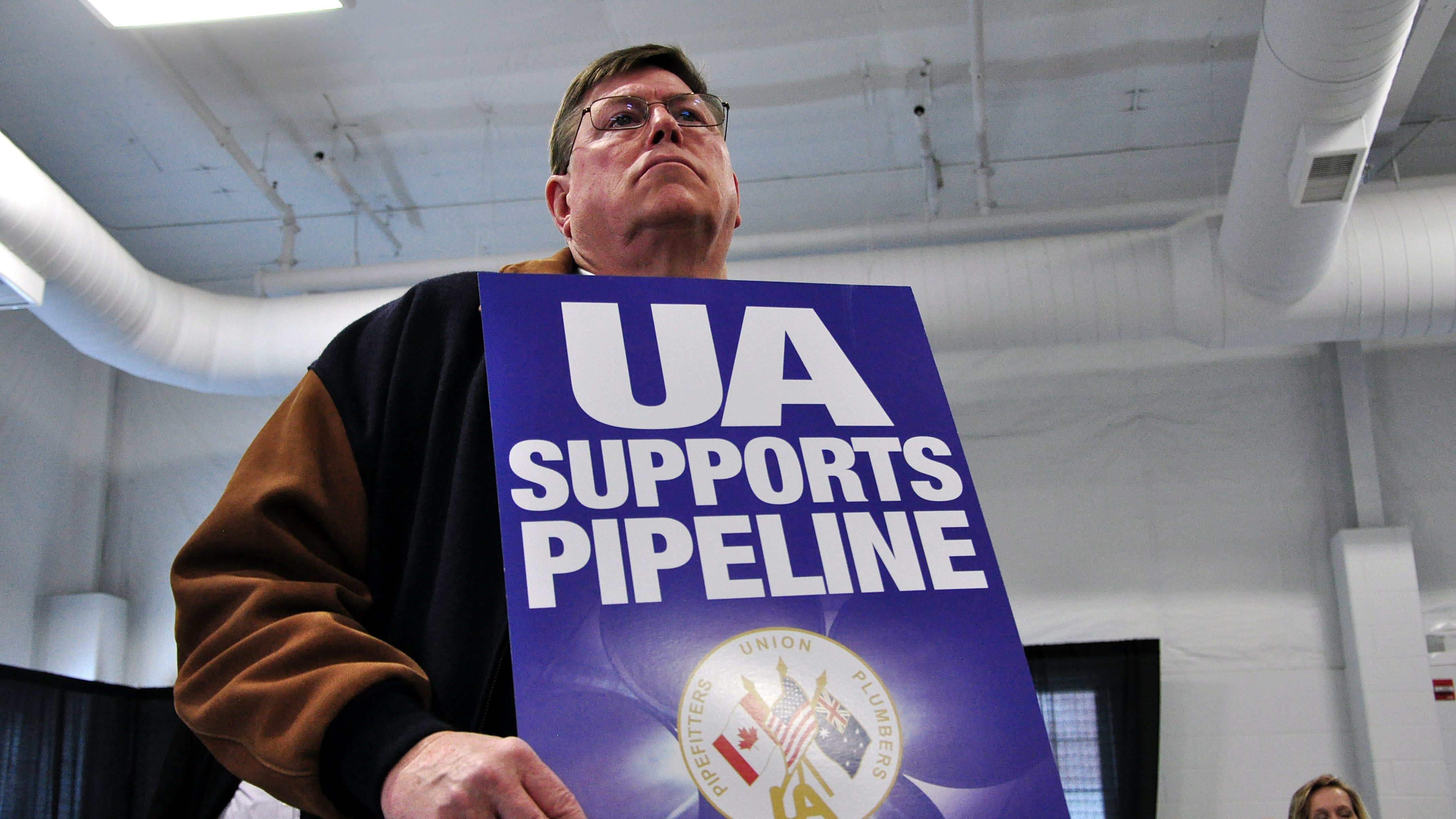Union members clashed with Keystone opponents at a pipeline hearing in April 2013, in Grand Island, Nebraska.
