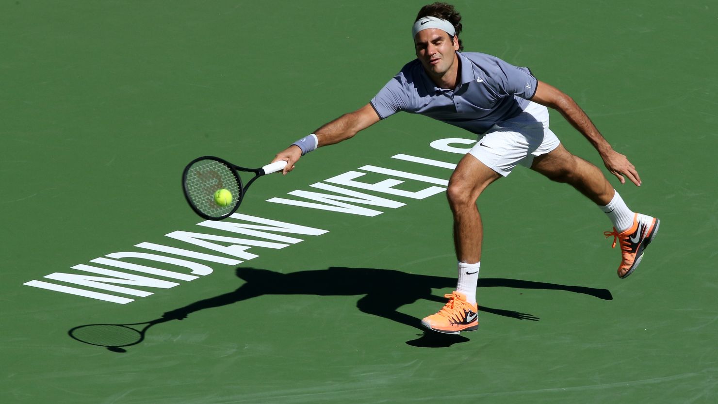 Roger Federer at full stretch during his third round match with Dmitry Tursunov in Monday.