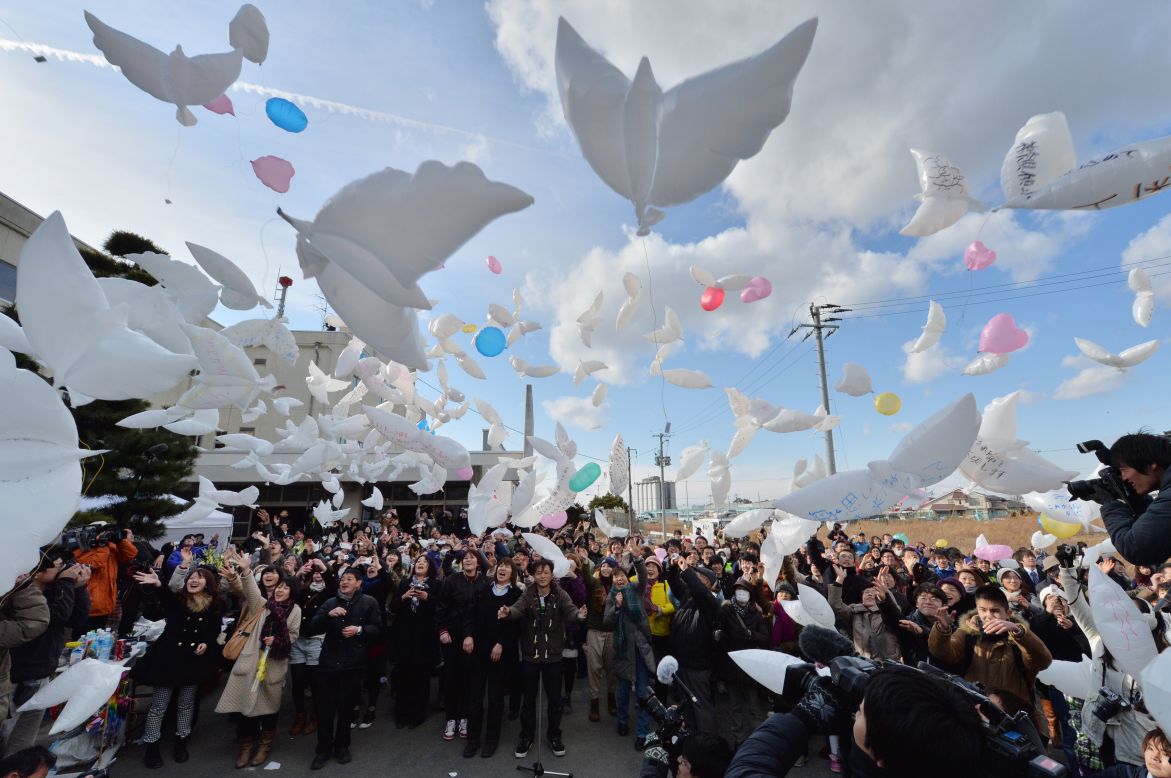 NATORI, JAPAN - MARCH 11: Dove-shaped balloons are released into the air during a memorial service for tsunami victims on the third anniversary of the massive earthquake that hit northern Japan. Nearly 19,000 people died in the aftermath of the disaster.