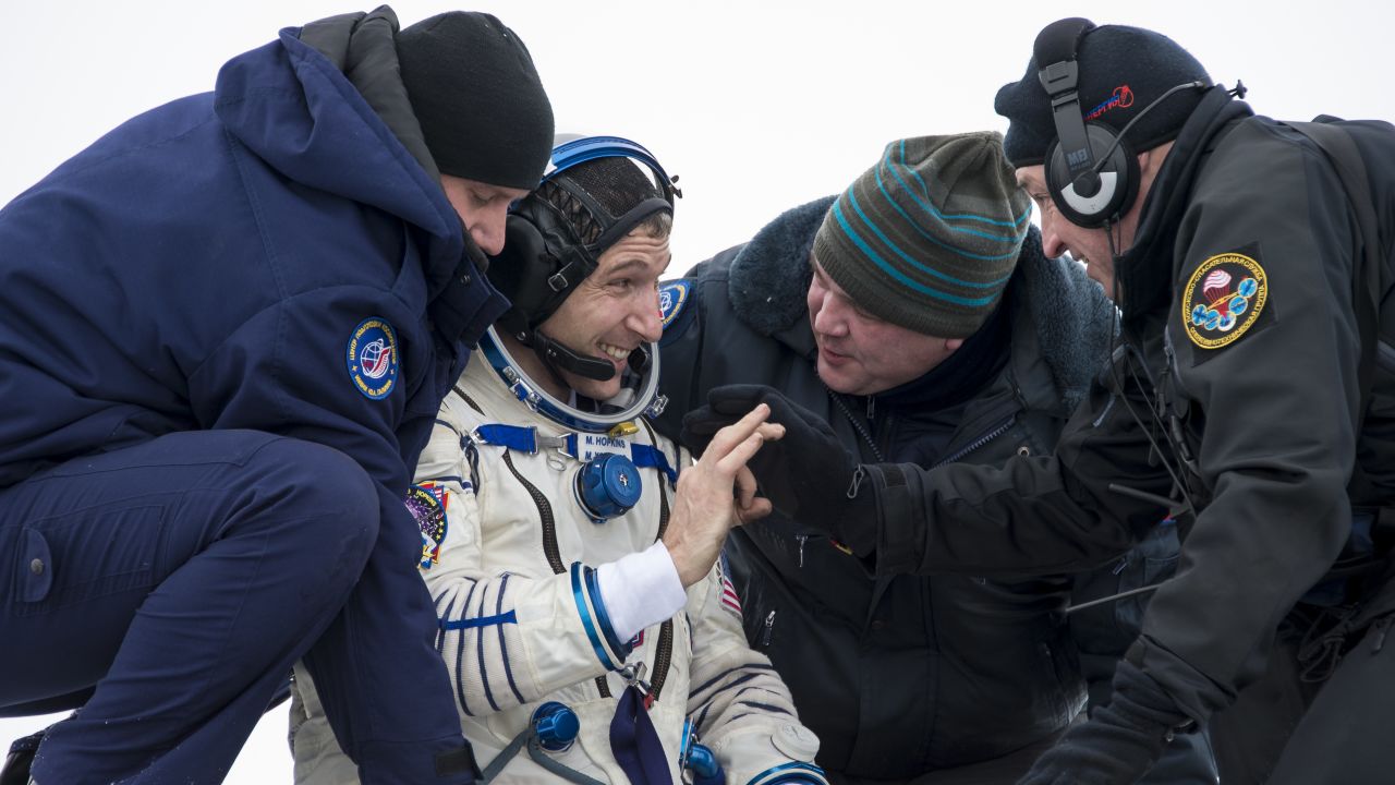 NASA's Mike Hopkins grins as he's helped from the Soyuz capsule near Zhezkazgan, Kazakhstan, on Tuesday.