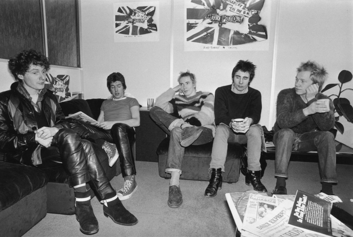 Westwood started her first clothes shop with Sex Pistols manager Malcolm McLaren (far left), pictured here with the British punk band in 1976.