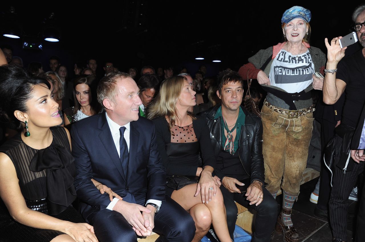 Westwood sports a t-shirt bearing the slogan "Climate Revolution" next to celebrities Salma Hayek, Francois Henri Pinault, Kate Moss and Jamie Hince.