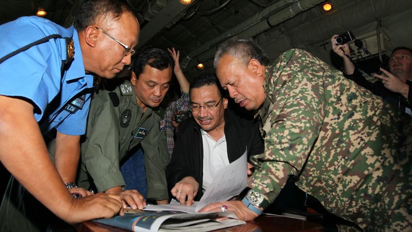 In this handout provided by the Angkatan Tentera Malaysia, Malaysian Royal Navy (TLDM) commander Tan Sri Abdul Aziz Jaafar (left), Lieutenant General Dato' Sri Ackbal bin Hj Abdul Samad (2nd left), Malaysian Defence Minister, Minister of Defence & (Acting) Minister of Transport Dato' Seri Hishammuddin Hussein (2nd right), and Malaysian Defence Forces chief Tan Sri Zulkifeli Mohd Zin discuss their strategy during a search and rescue mission flight on March 11, 2014 in Kuala Lumpur, Malaysia.