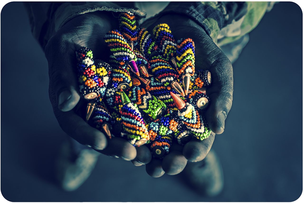 <strong>CNN: How many "weapons" did the artisans create in total?</strong><br /><br /><strong>RZ:</strong> We started off with a single gun, then six a week, then ten a week. In the end we had over two hundred guns and thousands of rounds of beaded ammunition. It took a whole day for the packers to wrap and stack the guns in boxes and they filled half of a metal shipping container by volume.