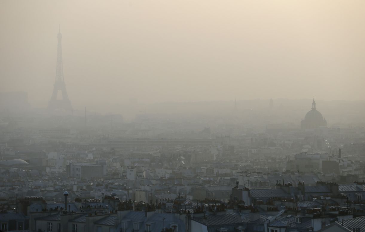 MARCH 12 - PARIS, FRANCE: The Eiffel tower and the roofs of Paris are only just visible through a haze of pollution. City officials said people prone to health problems, children and seniors should remain indoors as three environmental organizations filed a lawsuit against the city for "<a href="http://edition.cnn.com/2013/10/17/health/geneva-air-pollution-carcinogenic-who/">endangering the lives of others</a>" by their lack of response.