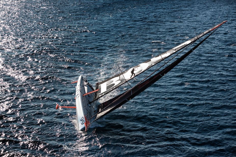 Thomson hurtles up the mast aware that the boat can keel at any moment and fling him onto the deck or the water below.