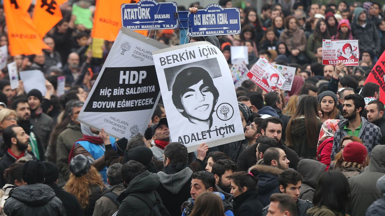 Protesters hold placards reading 'We want justice for Berkin Elvan' on March 11, 2014, in Ankara.