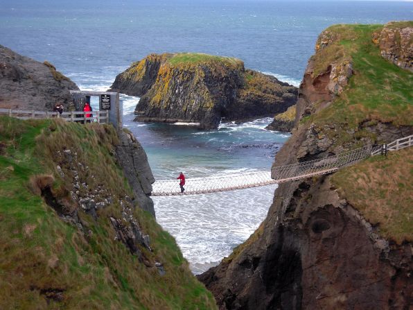 CNN readers <a href="http://ireport.cnn.com/topics/1100238">share their best memories and photos</a> from mesmerizing visits to the Emerald Isle. Some of the island's most beautiful areas are in the north, repeat visitor <a href="http://ireport.cnn.com/docs/DOC-1100483">Kevin Kane</a> said. He shot this photo of Carrick-a-Rede Rope Bridge near Ballintoy on the Antrim Coast in Northern Ireland. 