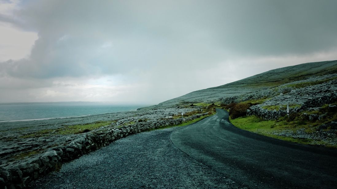 An empty road winds along the Atlantic Coast near Doolin, in County Clare. 