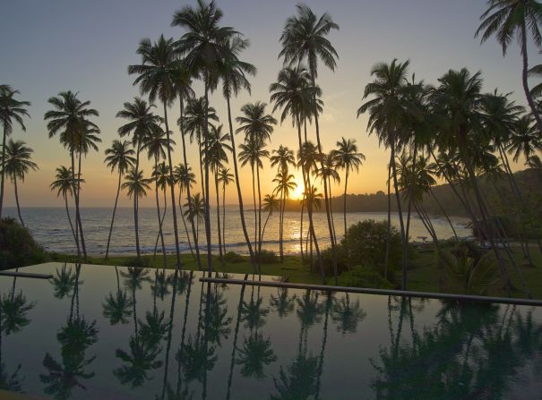 Sunset across the pool at <a href="index.php?page=&url=http%3A%2F%2Fwww.amanresorts.com%2Famanwella%2Fhome.aspx" target="_blank" target="_blank">Amanwella</a> in Tangalle. The 30-suite resort offers the best quality accommodations in the area and is justifiably in demand during the December to April peak season.