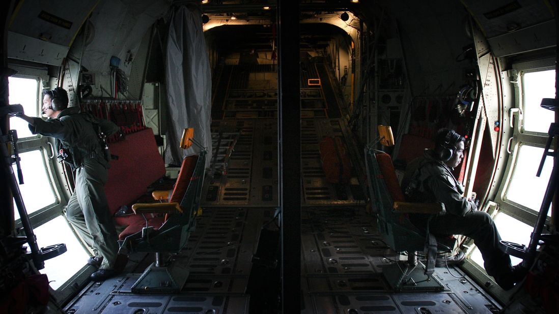 Malaysian air force members look for debris near Kuala Lumpur on March 13, 2014.