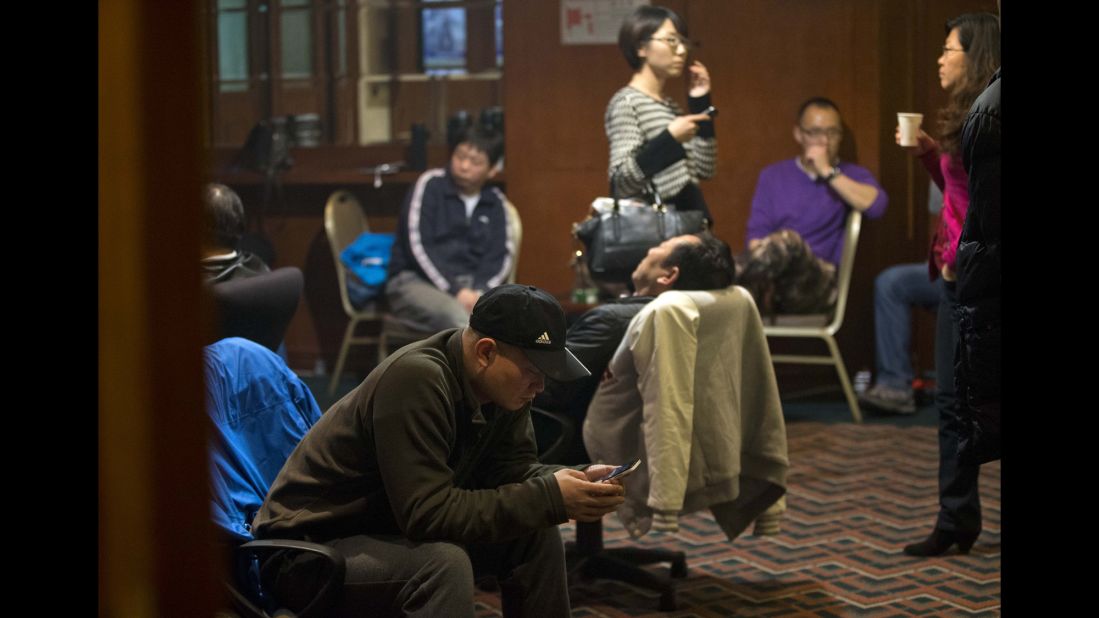 Relatives of missing passengers wait for the latest news at a hotel in Beijing on March 12, 2014.