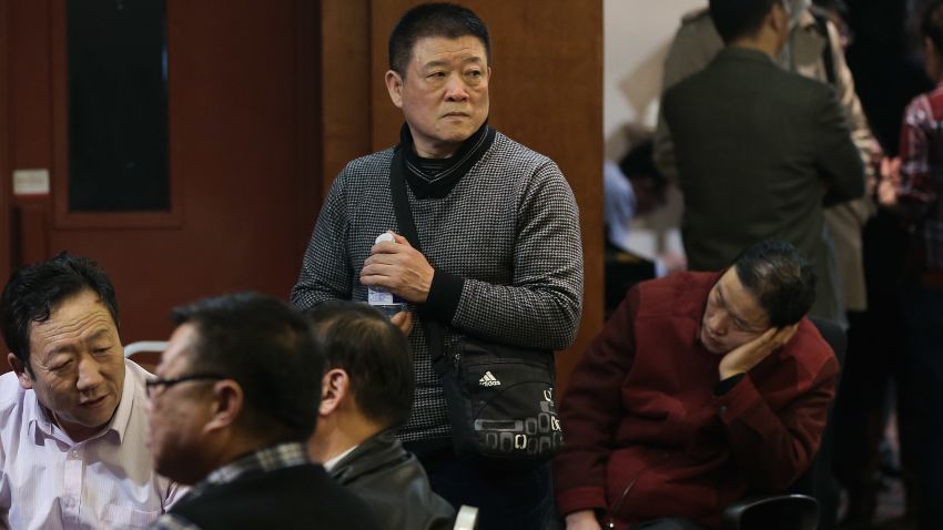 BEIJING, CHINA - MARCH 12: Chinese relatives of the passengers onboard Malaysia Airlines flight MH370 gather inside the relative area at Lido Hotel on March 12, 2014 in Beijing, China. Officials have expanded the searh area for missing Malaysia Airlines flight MH370 to include more of the Gulf of Thailand between Malaysia and Vietnam and land along the Malay Peninsula. The flight carrying 239 passengers from Kuala Lumpur to Thailand was reported missing on the morning of March 8 after the crew failed to check in as scheduled. Relatives of the missing passengers have been advised to prepare for the worst as authorities focus on two passengers on board travelling with stolen passports. (Photo by Lintao Zhang/Getty Images)