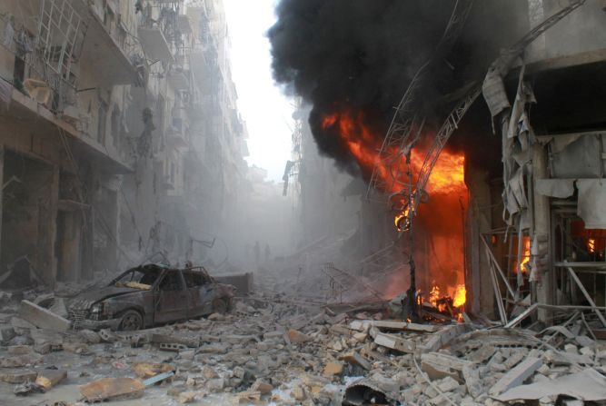 Debris covers a street in Aleppo, Syria, after a reported government airstrike on Friday, March 7. More than 100,000 people have been killed in <a href="http://www.cnn.com/2014/02/10/middleeast/gallery/syria-unrest-2014/index.html">the Syrian conflict</a> since it started in March 2011, the United Nations estimates.