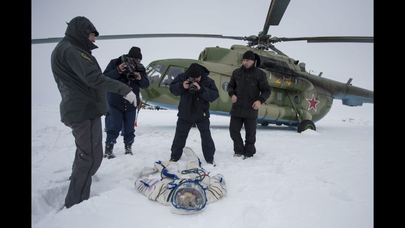 A photographer documents the suit worn by American astronaut Mike Hopkins after <a href="http://www.cnn.com/2014/03/11/tech/innovation/russia-us-space-program-ukraine/index.html">a Soyuz TMA-10 capsule landed</a> near Zhezkazgan, Kazakhstan, on Tuesday, March 11. The capsule brought Hopkins and two cosmonauts home to Earth after they spent five months aboard the International Space Station.