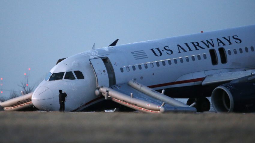 US Airways Flight 1702 sits at the end of a runway at the Philadelphia International Airport on Thursday.