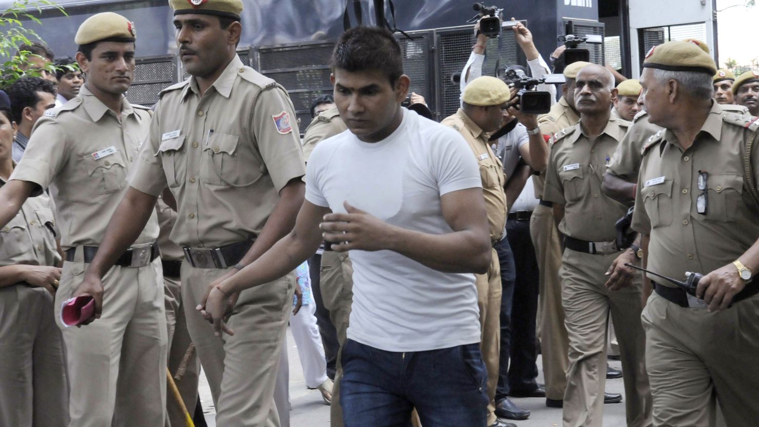 Vinay Sharma, one of the accused, is led into court in September 2013.