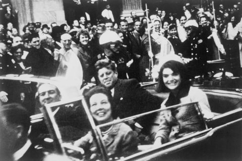 U.S. President John F. Kennedy sits with the first lady in the back of a limousine November 22, 1963, in Dallas. Kennedy's assassination remains one of the most shocking events of the 20th century, and it's one of its biggest mysteries. While a blue-ribbon panel concluded that there was only one gunman, a Gallup survey six decades later found that 60% of Americans don't believe that.